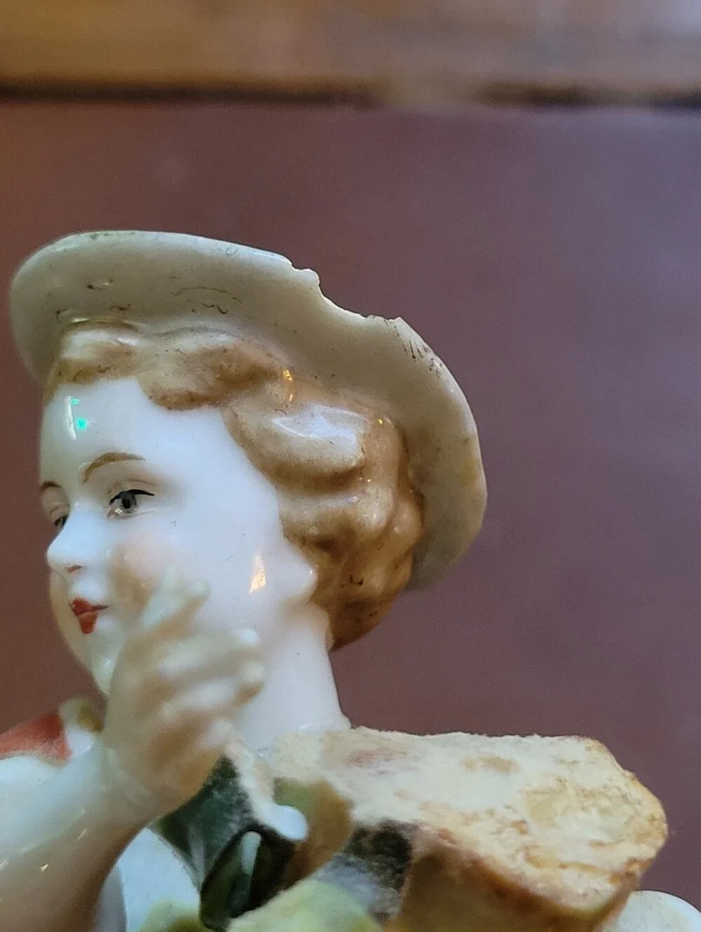 antique porcelain figurine, likely German from around 1900-repaired